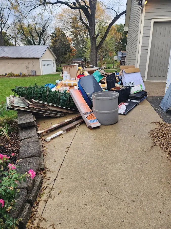 Dumpster being loaded with debris for 3 Yard Dumpster Rental in Morgan Hill